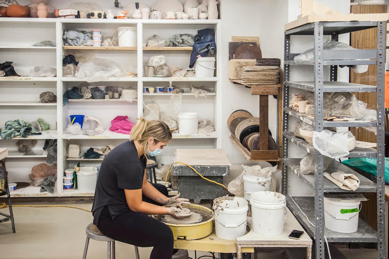 woman making ceramics in an art studio